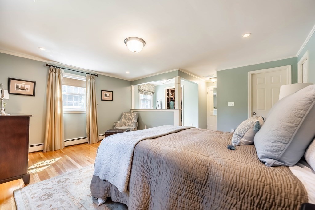 1 Rennie Drive Andover, MA 01810 - Photo 21 of 39 a bedroom with a bed and wooden floor