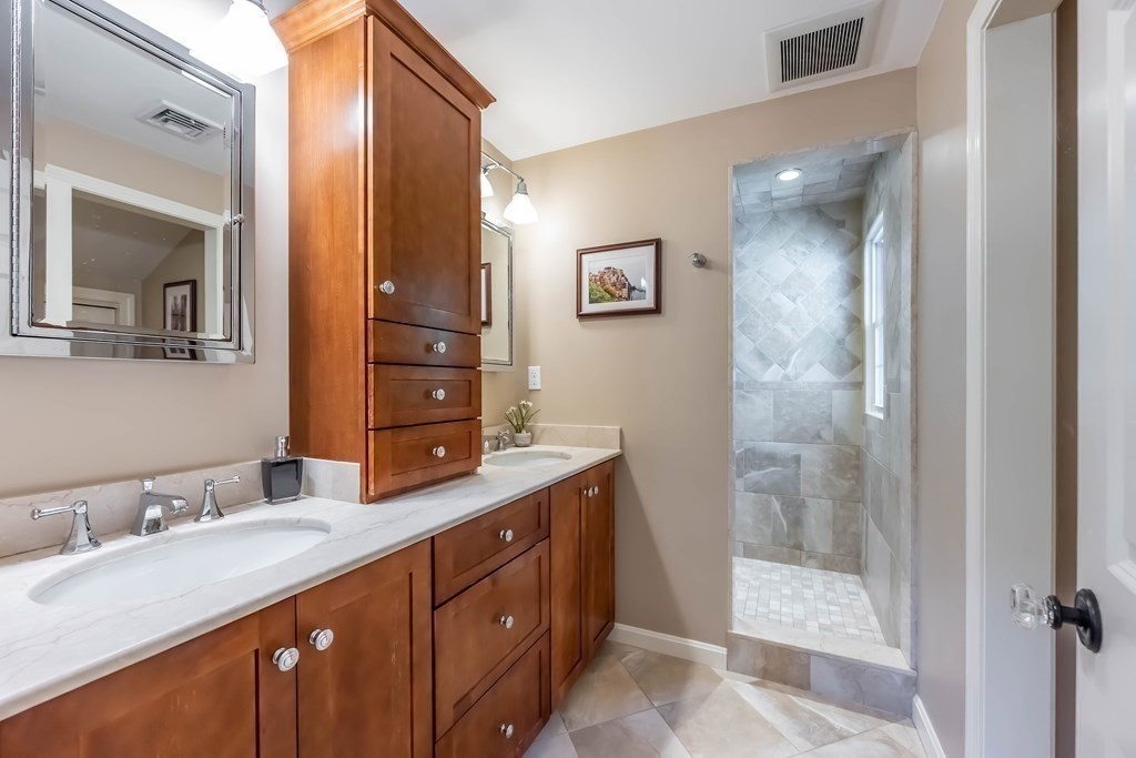 1 Rennie Drive Andover, MA 01810 - Photo 25 of 39 a bathroom with a granite countertop sink mirror and double