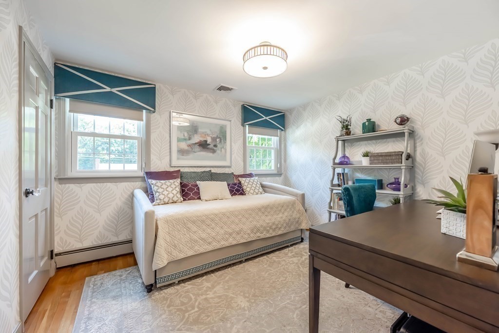 1 Rennie Drive Andover, MA 01810 - Photo 27 of 39 a bedroom with a bed and a potted plant
