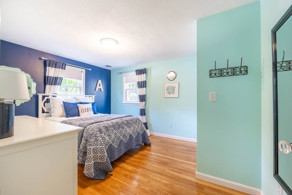 1 Rennie Drive Andover, MA 01810 - Photo 28 of 39 a bedroom with a bed and wooden floor