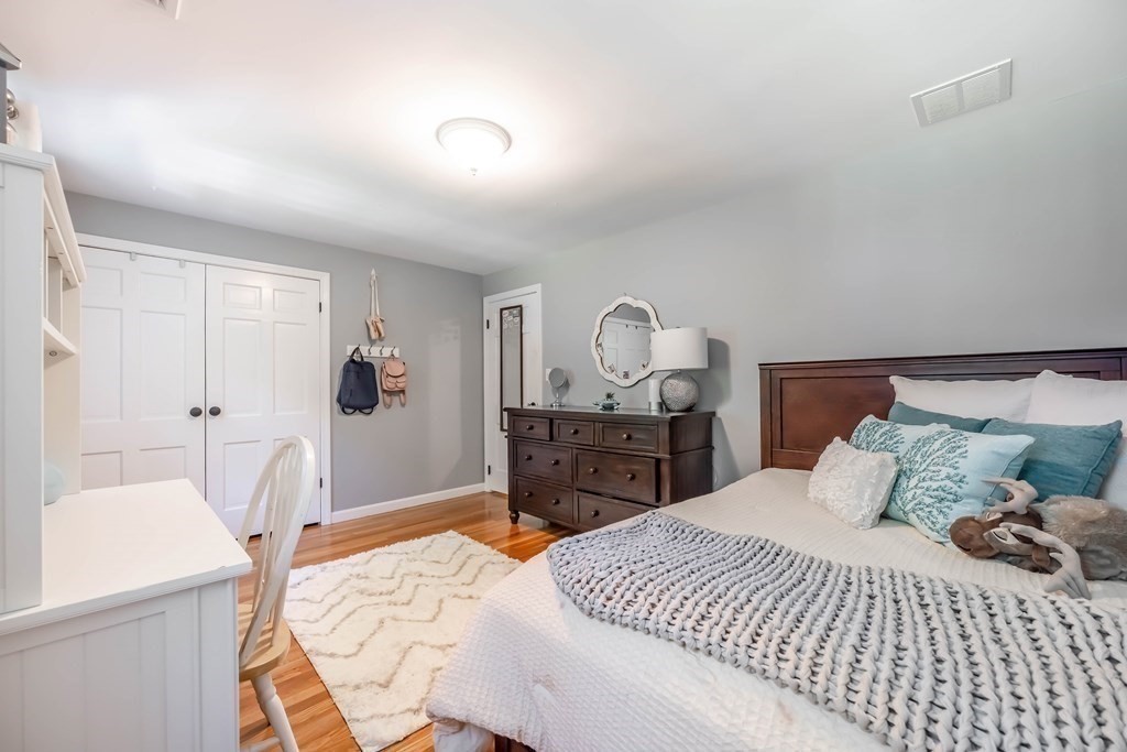 1 Rennie Drive Andover, MA 01810 - Photo 29 of 39 a bedroom with a large bed and a dresser
