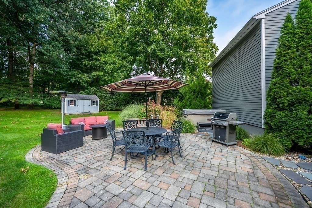 1 Rennie Drive Andover, MA 01810 - Photo 35 of 39 a view of backyard with outdoor seating a patio and a garden