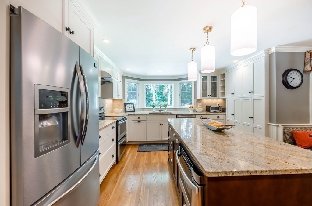 1 Rennie Drive Andover, MA 01810 - Photo 5 of 39 a kitchen with counter top space a sink and stainless steel appliances