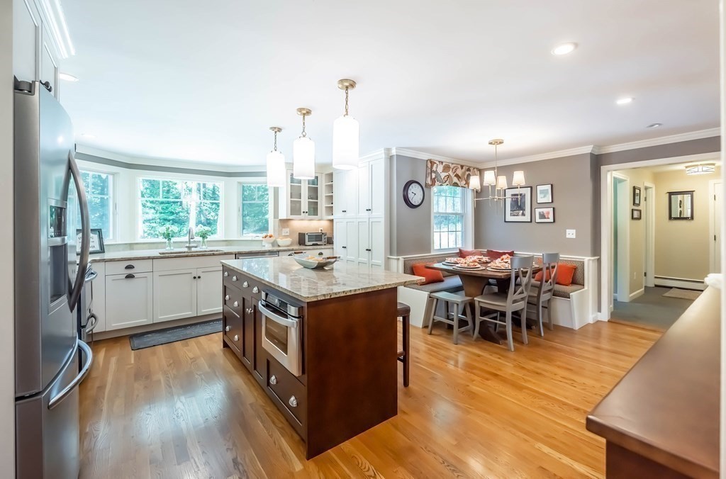 1 Rennie Drive Andover, MA 01810 - Photo 6 of 39 a kitchen with stainless steel appliances granite countertop a stove and a refrigerator