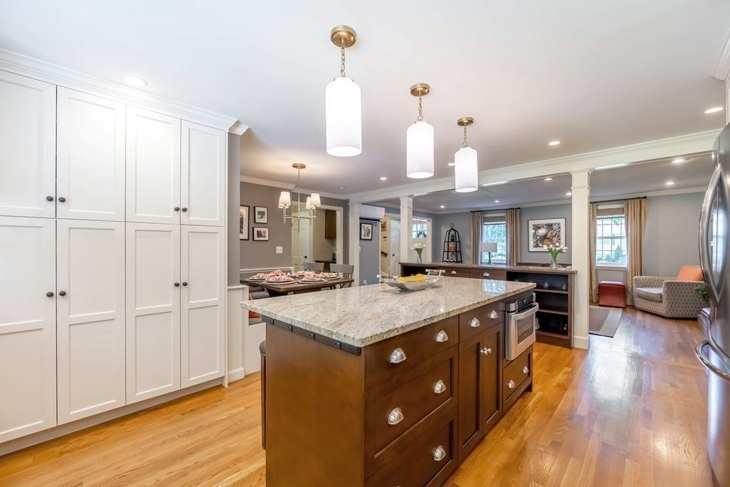 1 Rennie Drive Andover, MA 01810 - Photo 7 of 39 a kitchen with a stove a counter top space and cabinets