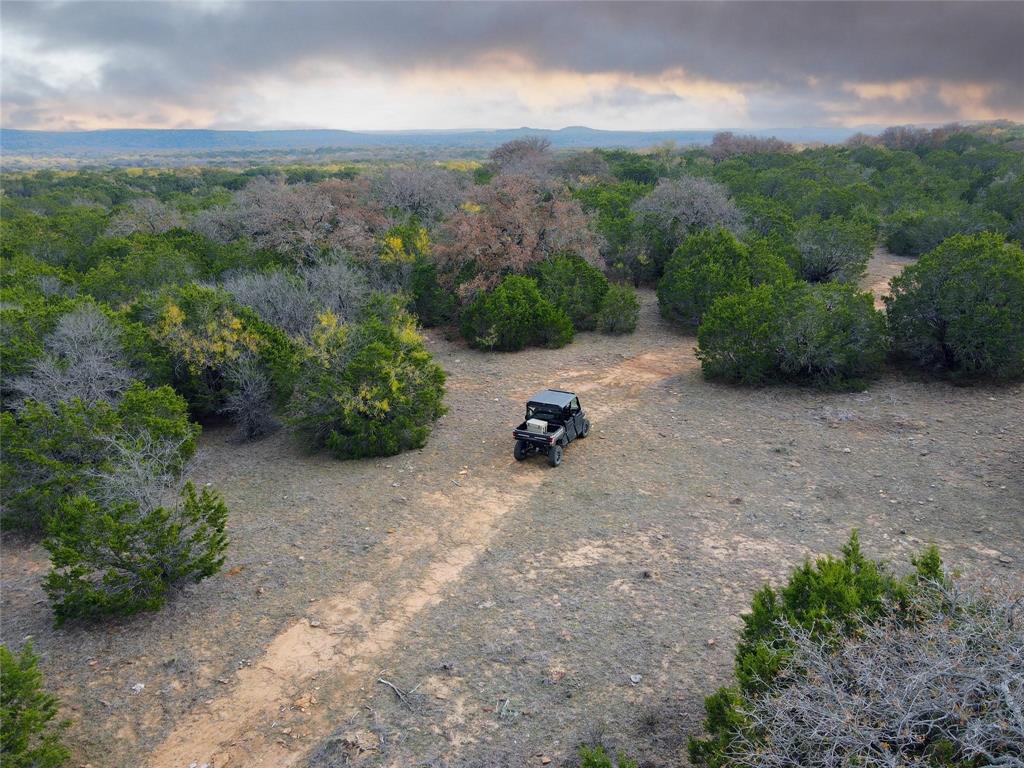 471 County Road 471 Strawn, TX 76475 - Photo 17 of 23 a view of a backyard with couches and table