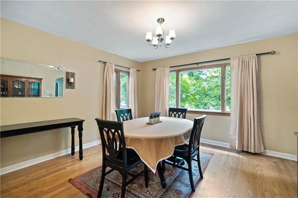 720 Perry Highway Pittsburgh, PA 15229 - Photo 12 of 39 a view of a dining room with furniture window and wooden floor