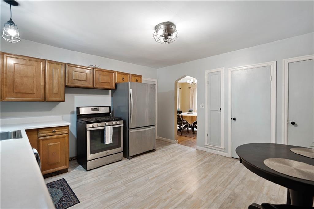 720 Perry Highway Pittsburgh, PA 15229 - Photo 14 of 39 a kitchen with stainless steel appliances granite countertop a refrigerator and stove