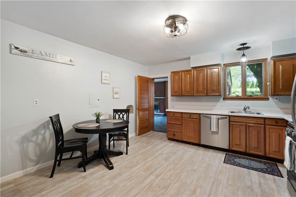 720 Perry Highway Pittsburgh, PA 15229 - Photo 15 of 39 a kitchen with granite countertop a sink cabinets and wooden floor