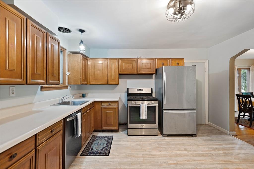 720 Perry Highway Pittsburgh, PA 15229 - Photo 16 of 39 a kitchen with stainless steel appliances granite countertop a refrigerator sink and cabinets
