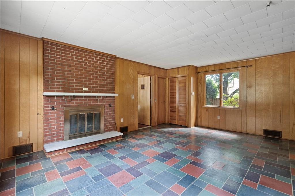 720 Perry Highway Pittsburgh, PA 15229 - Photo 17 of 39 a view of an empty room with a fireplace and a window