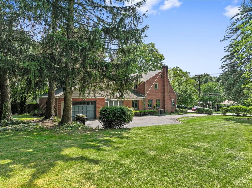 720 Perry Highway Pittsburgh, PA 15229 - Photo 2 of 39 a front view of a house with garden