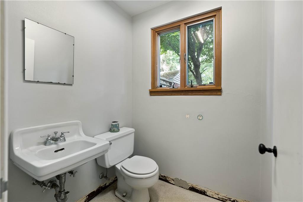 720 Perry Highway Pittsburgh, PA 15229 - Photo 23 of 39 a bathroom with a toilet sink and mirror
