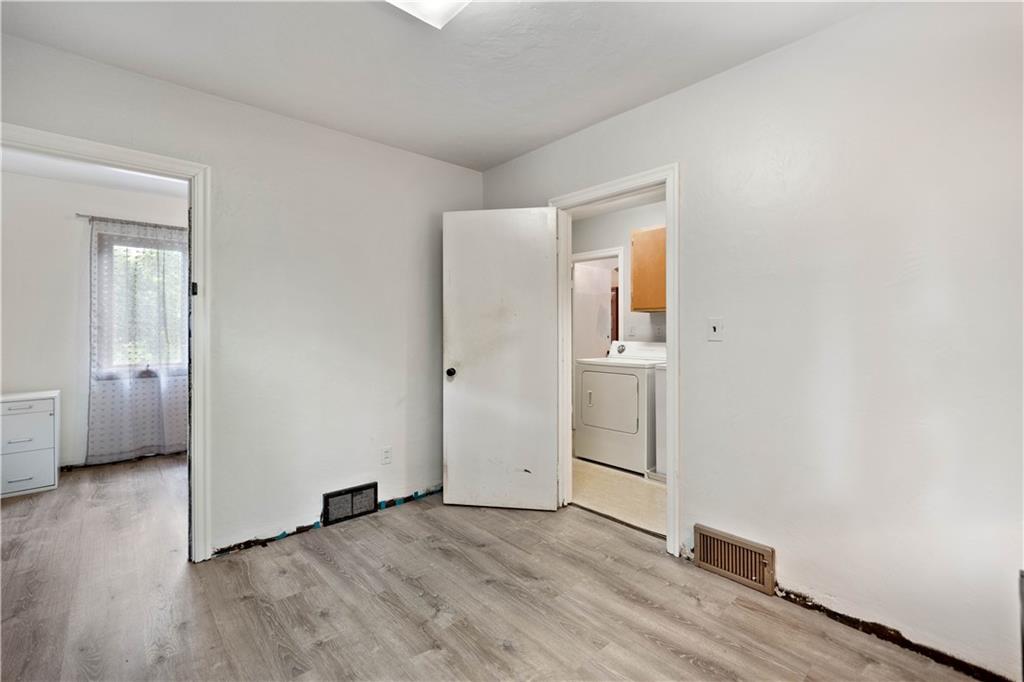 720 Perry Highway Pittsburgh, PA 15229 - Photo 25 of 39 an empty room with wooden floor and windows