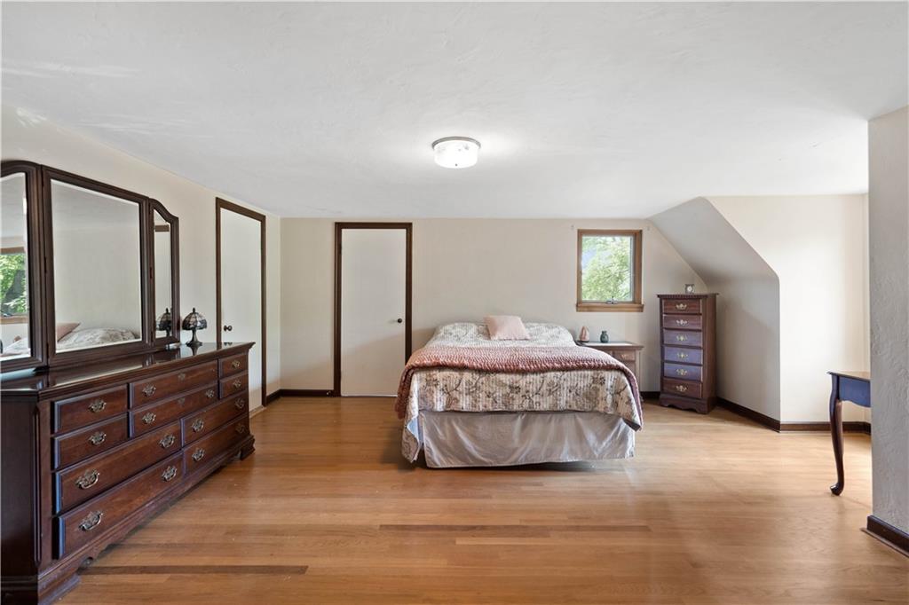 720 Perry Highway Pittsburgh, PA 15229 - Photo 28 of 39 a spacious bedroom with a large bed and a dresser