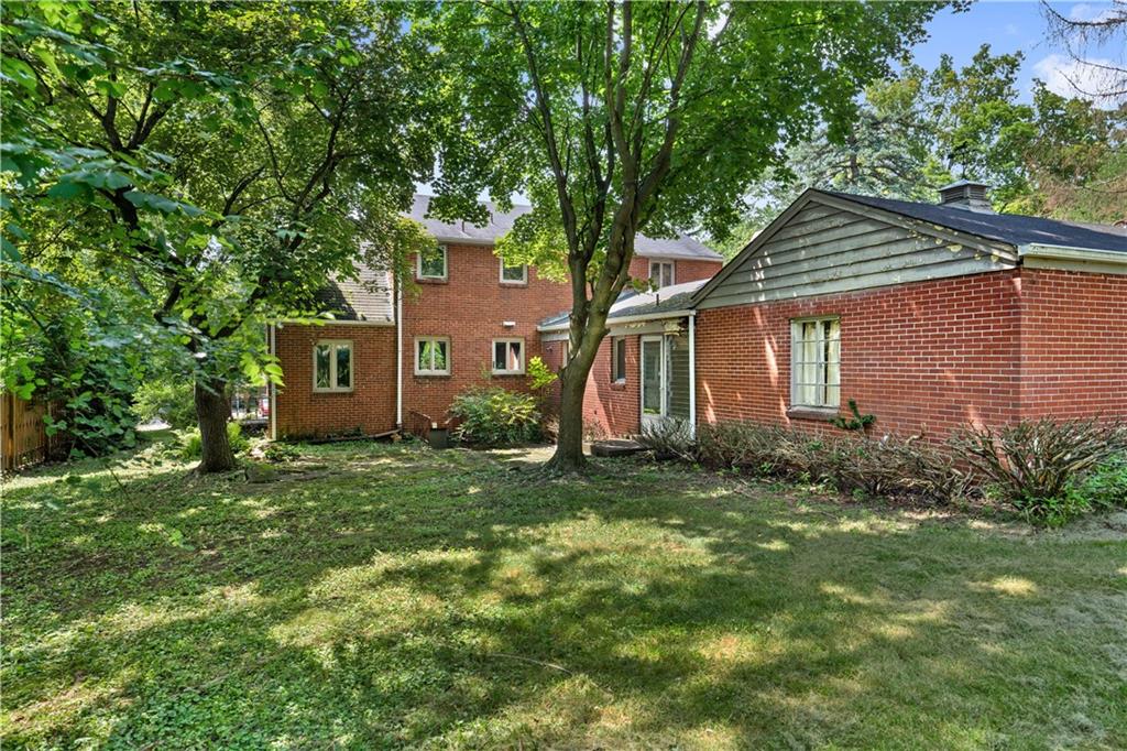 720 Perry Highway Pittsburgh, PA 15229 - Photo 4 of 39 a house that has a tree in front of it