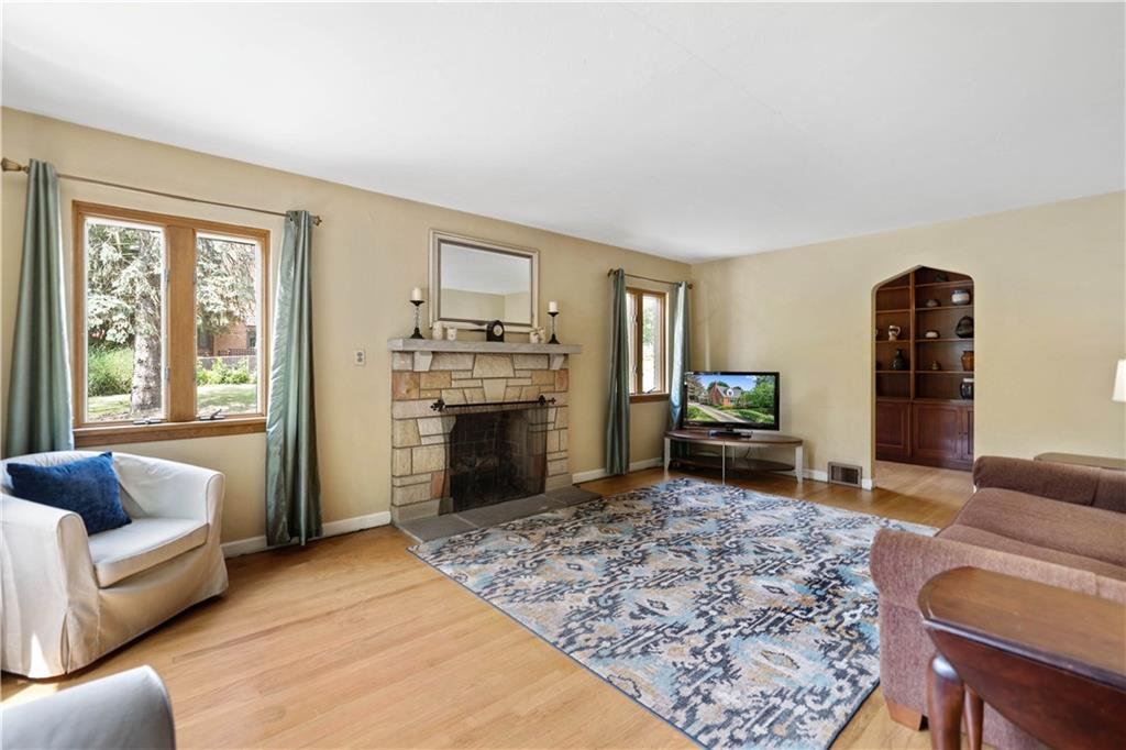 720 Perry Highway Pittsburgh, PA 15229 - Photo 6 of 39 a living room with furniture and a fireplace