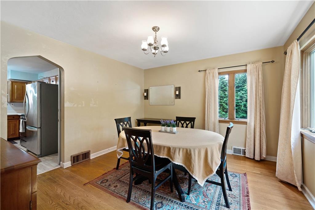 720 Perry Highway Pittsburgh, PA 15229 - Photo 10 of 39 a view of a dining room with furniture window and wooden floor