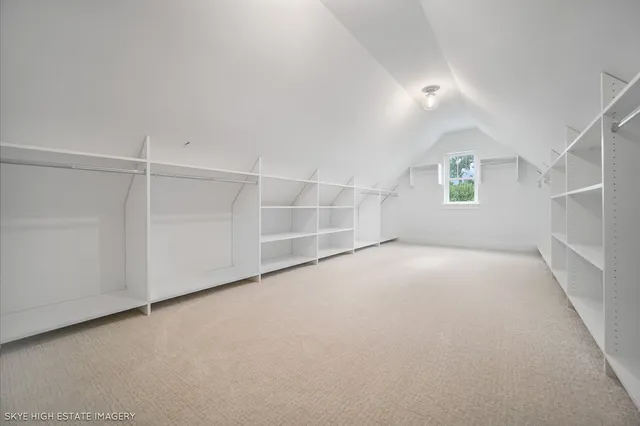 en empty room with windows and ceiling fan