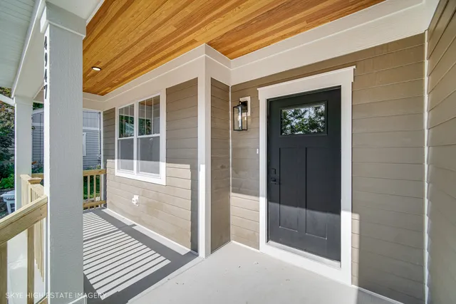 a view of a brick house with a large window