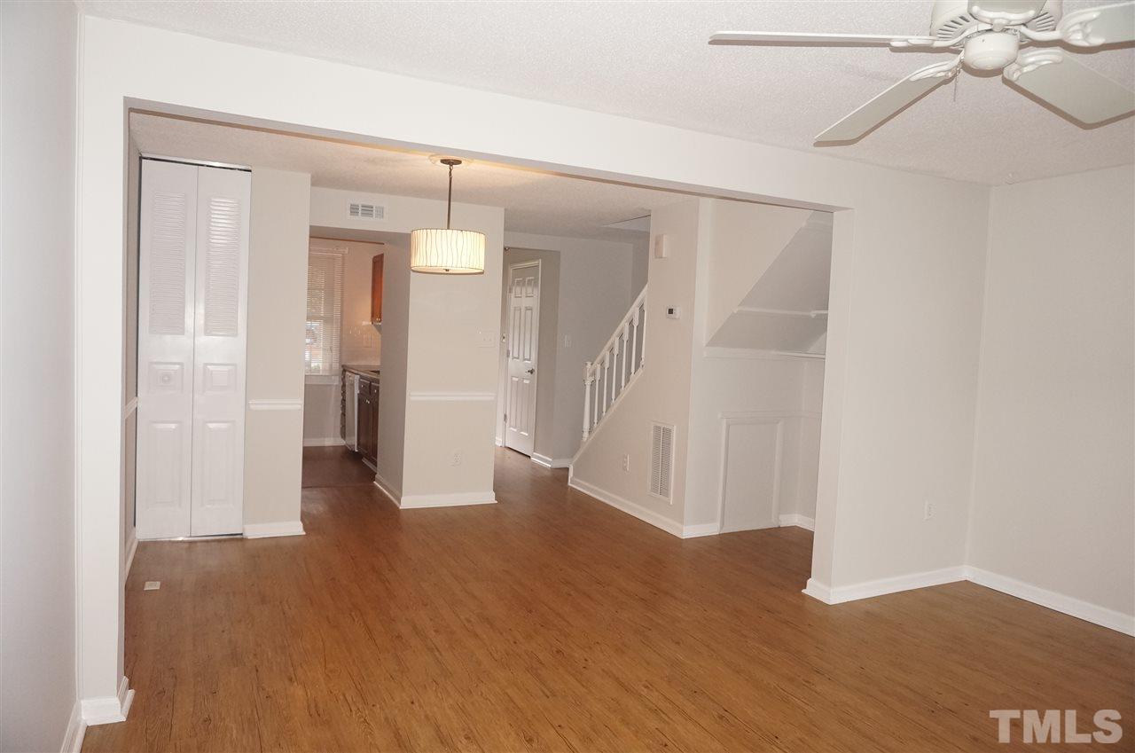 7709 Crown Crest Court Raleigh, NC 27615 - Photo 11 of 21 a view of a hallway with wooden floor