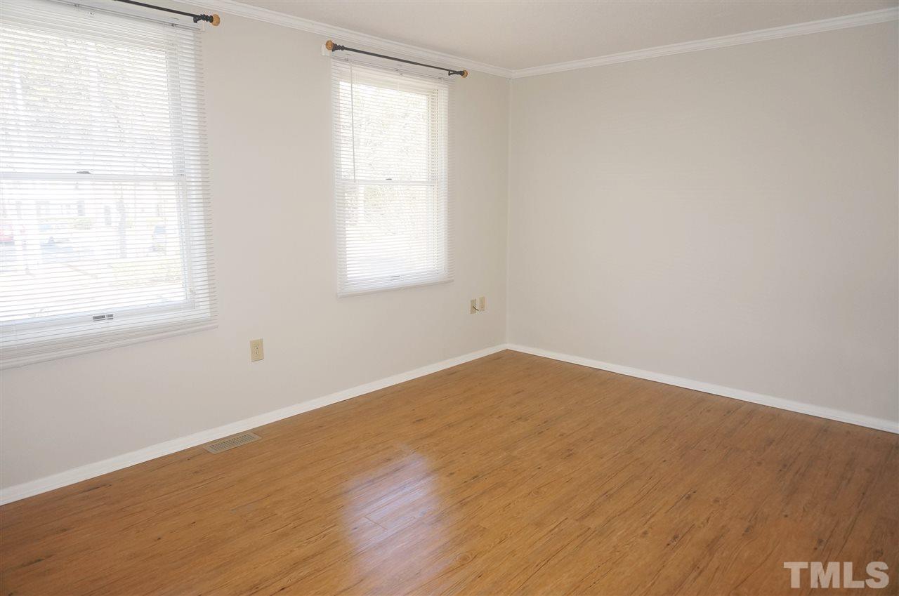 7709 Crown Crest Court Raleigh, NC 27615 - Photo 15 of 21 an empty room with a window