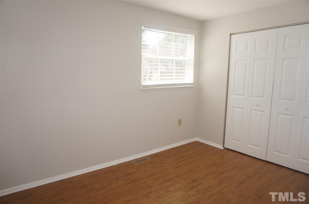 7709 Crown Crest Court Raleigh, NC 27615 - Photo 16 of 21 an empty room with a window