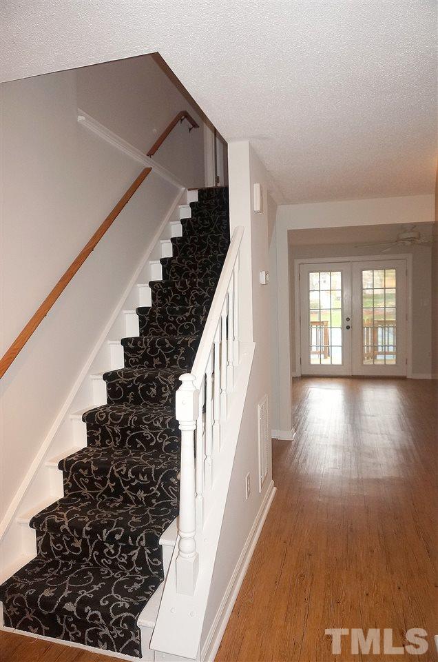 7709 Crown Crest Court Raleigh, NC 27615 - Photo 7 of 21 a view of entryway with wooden floor