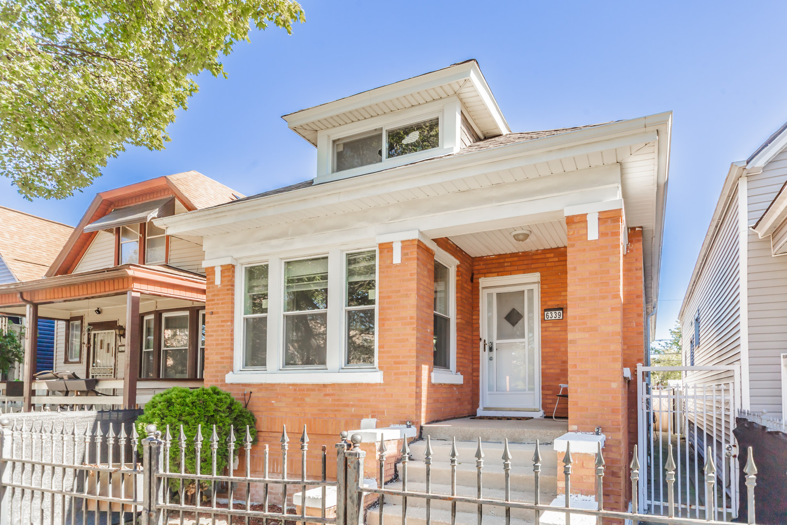 6339 South Troy Street Chicago, IL 60629 - Photo 1 of 19 a front view of a house