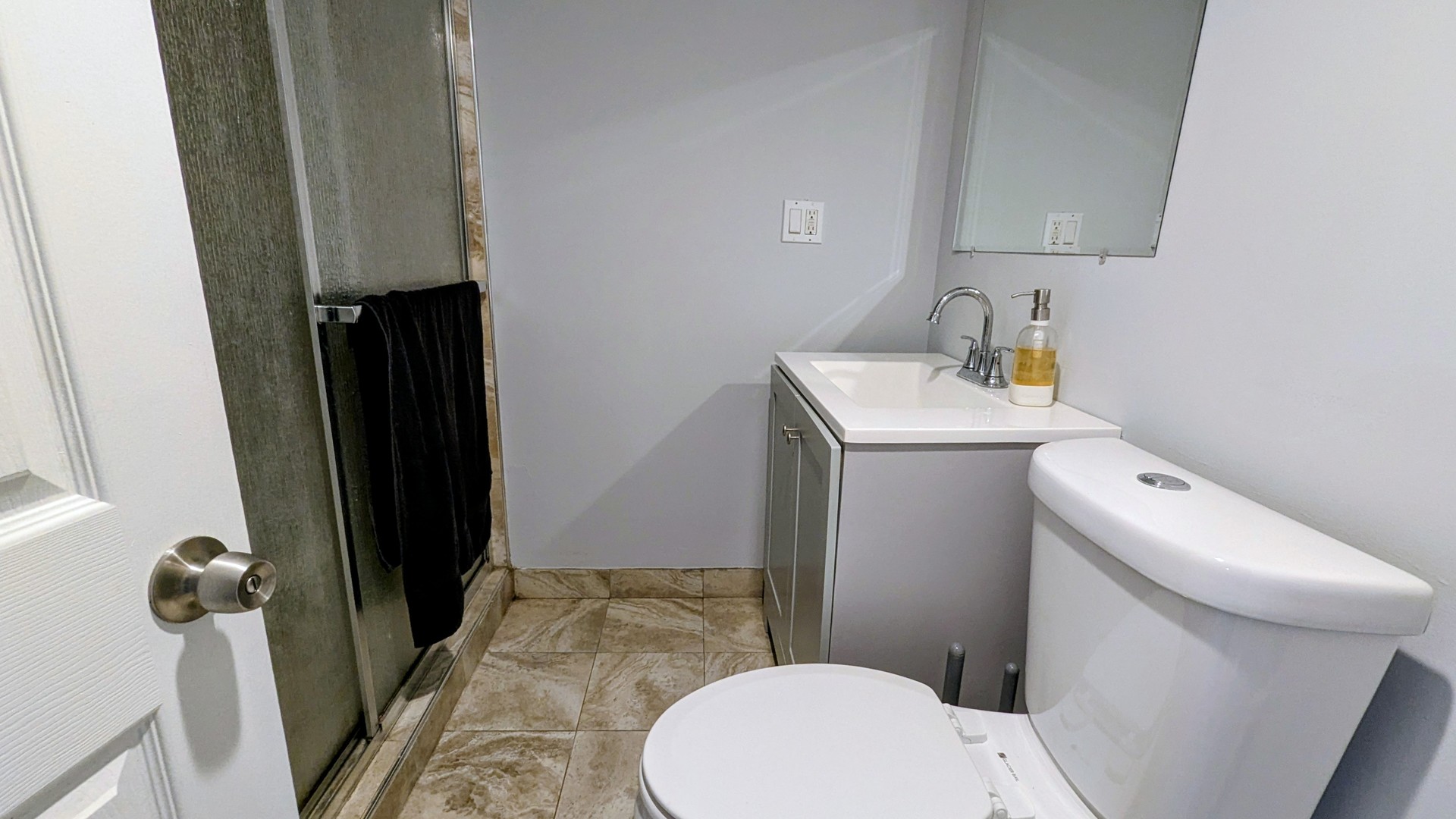 6339 South Troy Street Chicago, IL 60629 - Photo 11 of 19 a bathroom with a sink a toilet and shower