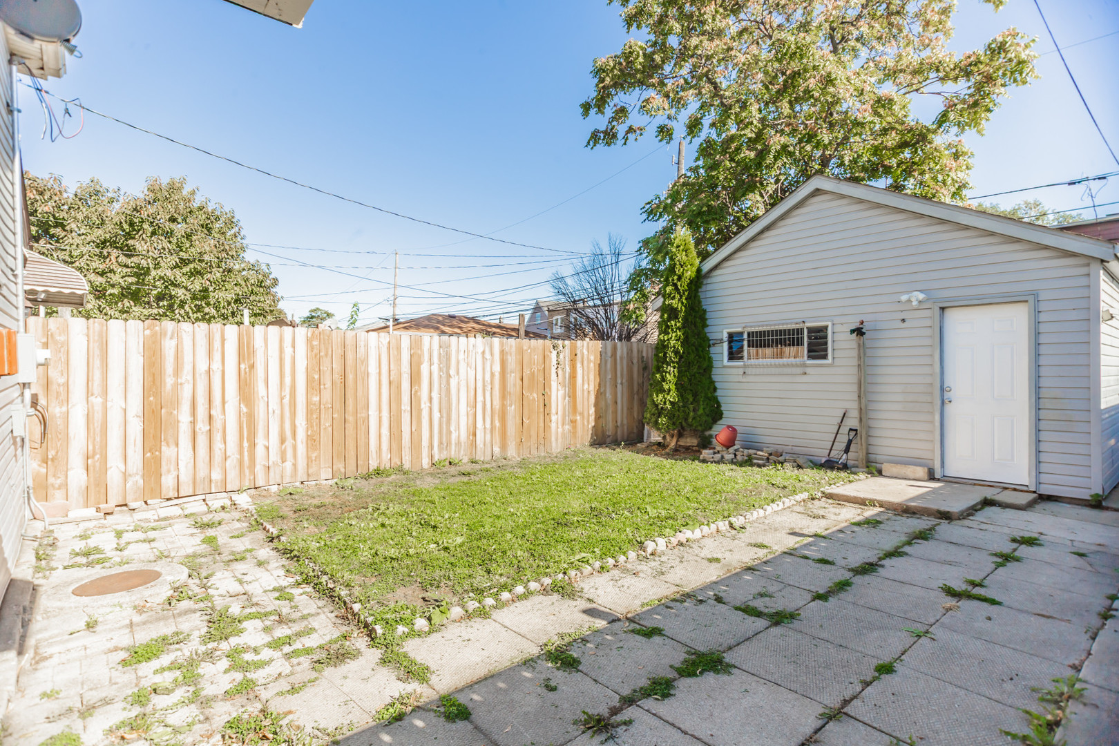 6339 South Troy Street Chicago, IL 60629 - Photo 17 of 19 a backyard of a house