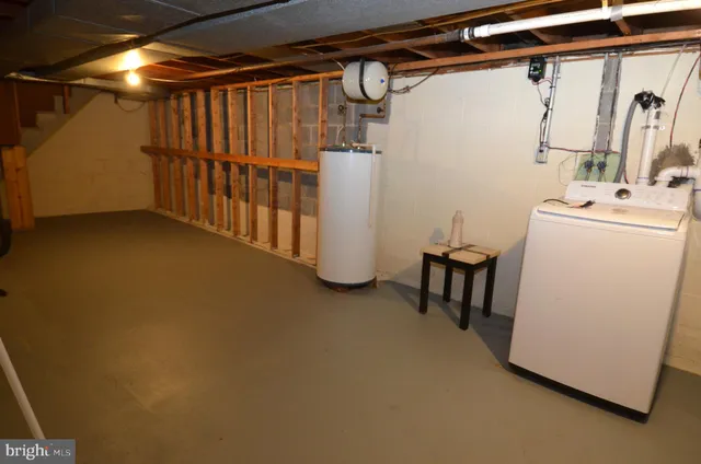 a view of a room with air conditioner duct and materials on floor