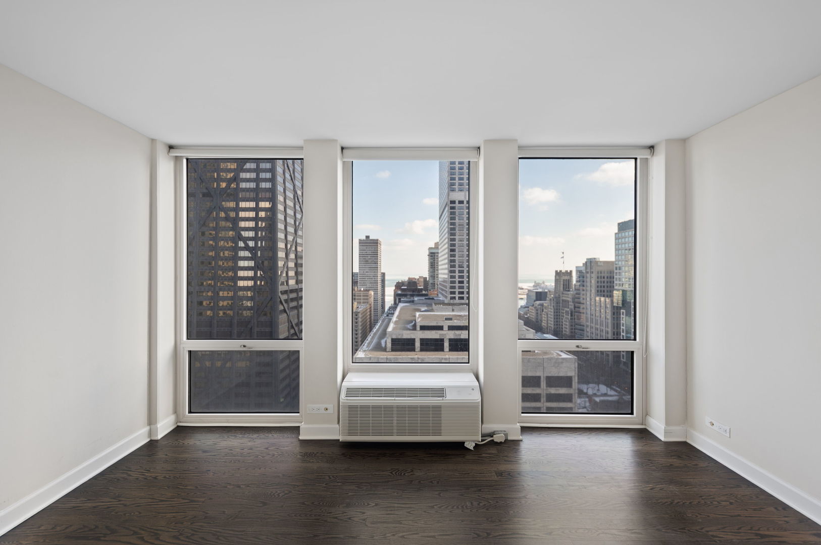 111 East Chestnut Street, Unit 30C Chicago, IL 60611 - Photo 13 of 27 a view of a room with wooden floor swimming pool and windows