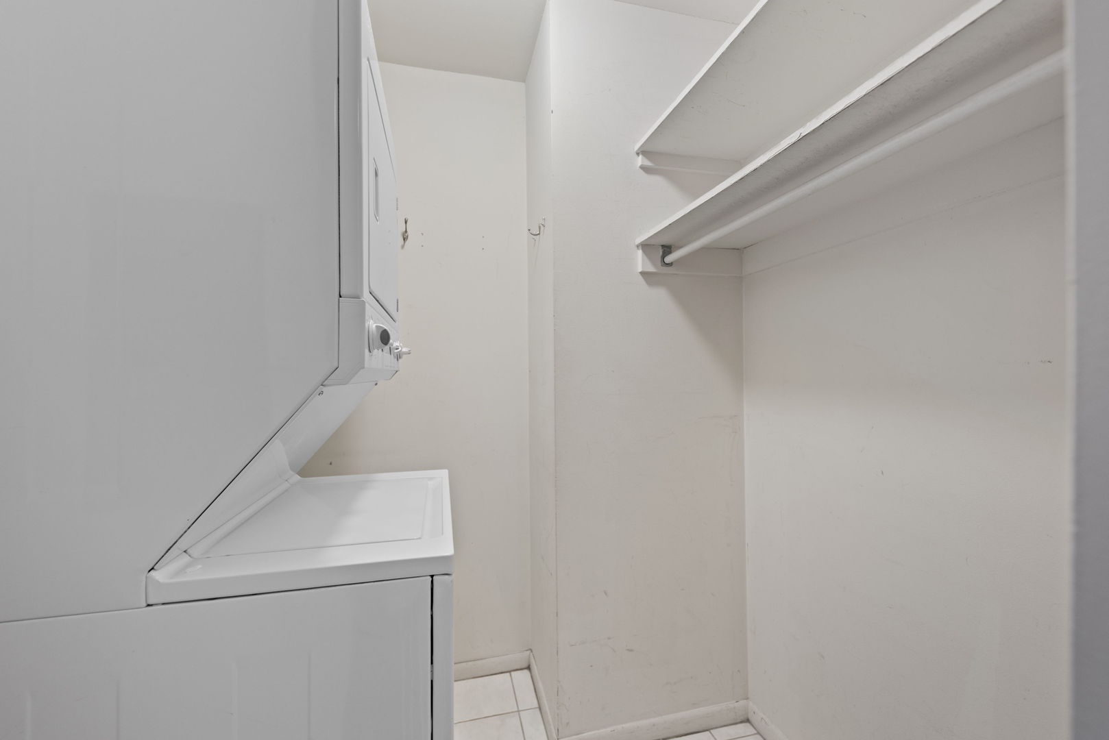 111 East Chestnut Street, Unit 30C Chicago, IL 60611 - Photo 17 of 27 a utility room with dryer and washer