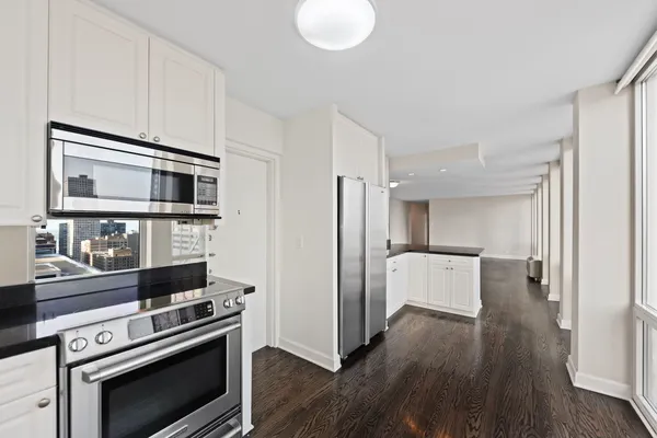 a kitchen with a stove and a microwave