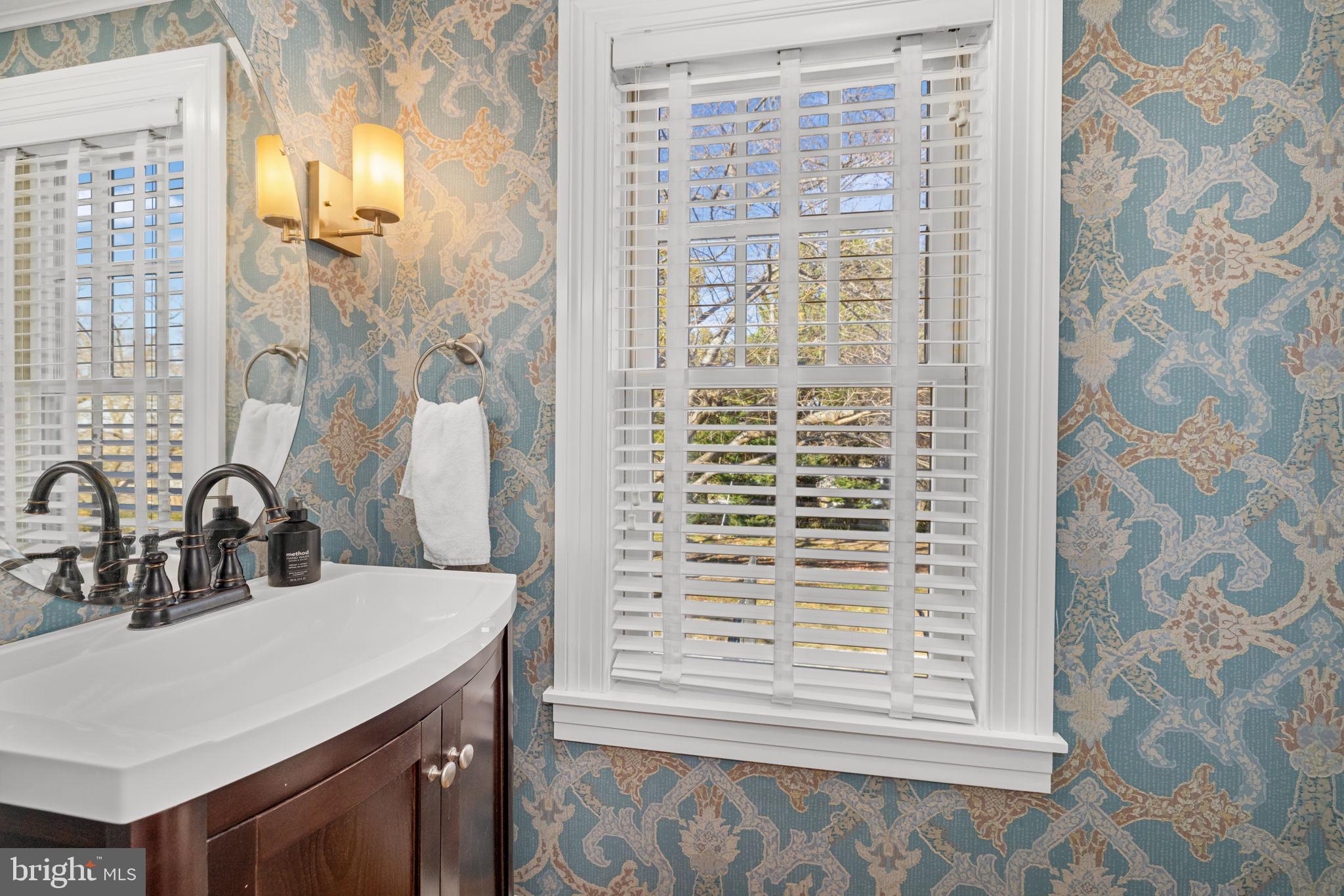 1138 Mayo Road Edgewater, MD 21037 - Photo 20 of 51 a bathroom with a sink a vanity and a shower