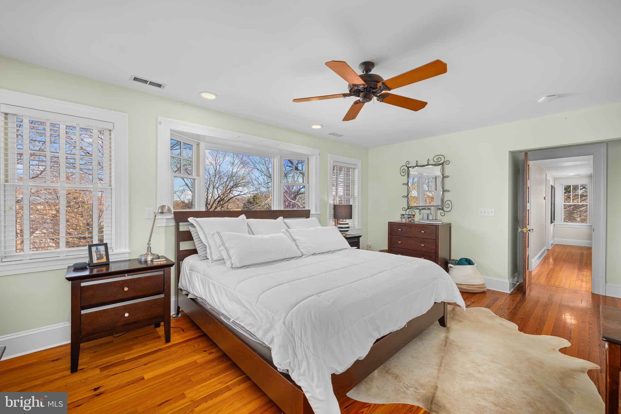1138 Mayo Road Edgewater, MD 21037 - Photo 23 of 51 a spacious bedroom with a bed and wooden floor
