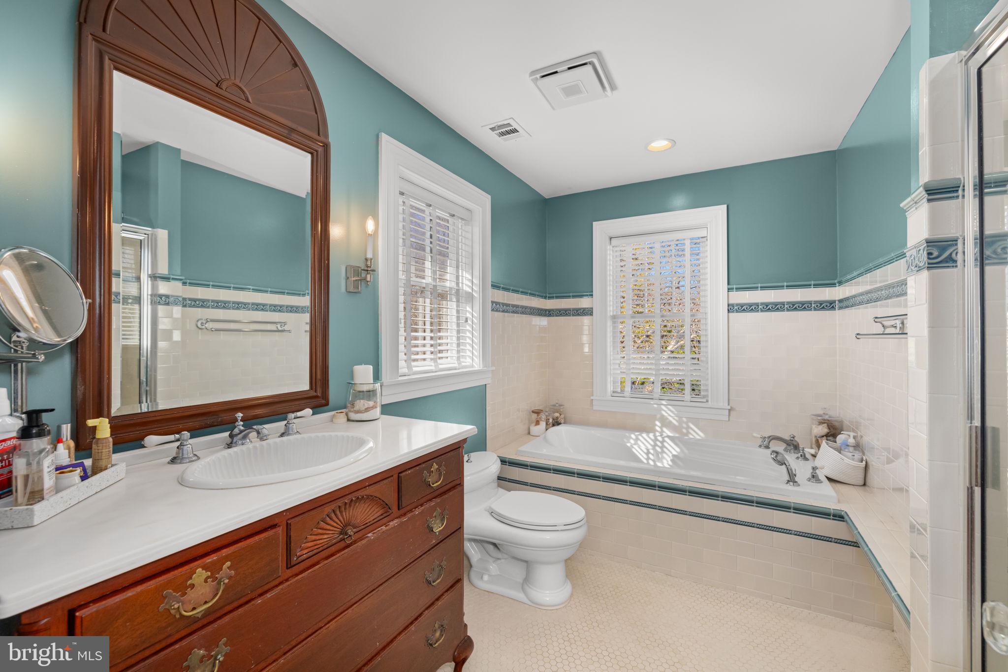 1138 Mayo Road Edgewater, MD 21037 - Photo 26 of 51 a bathroom with a granite countertop sink toilet and shower