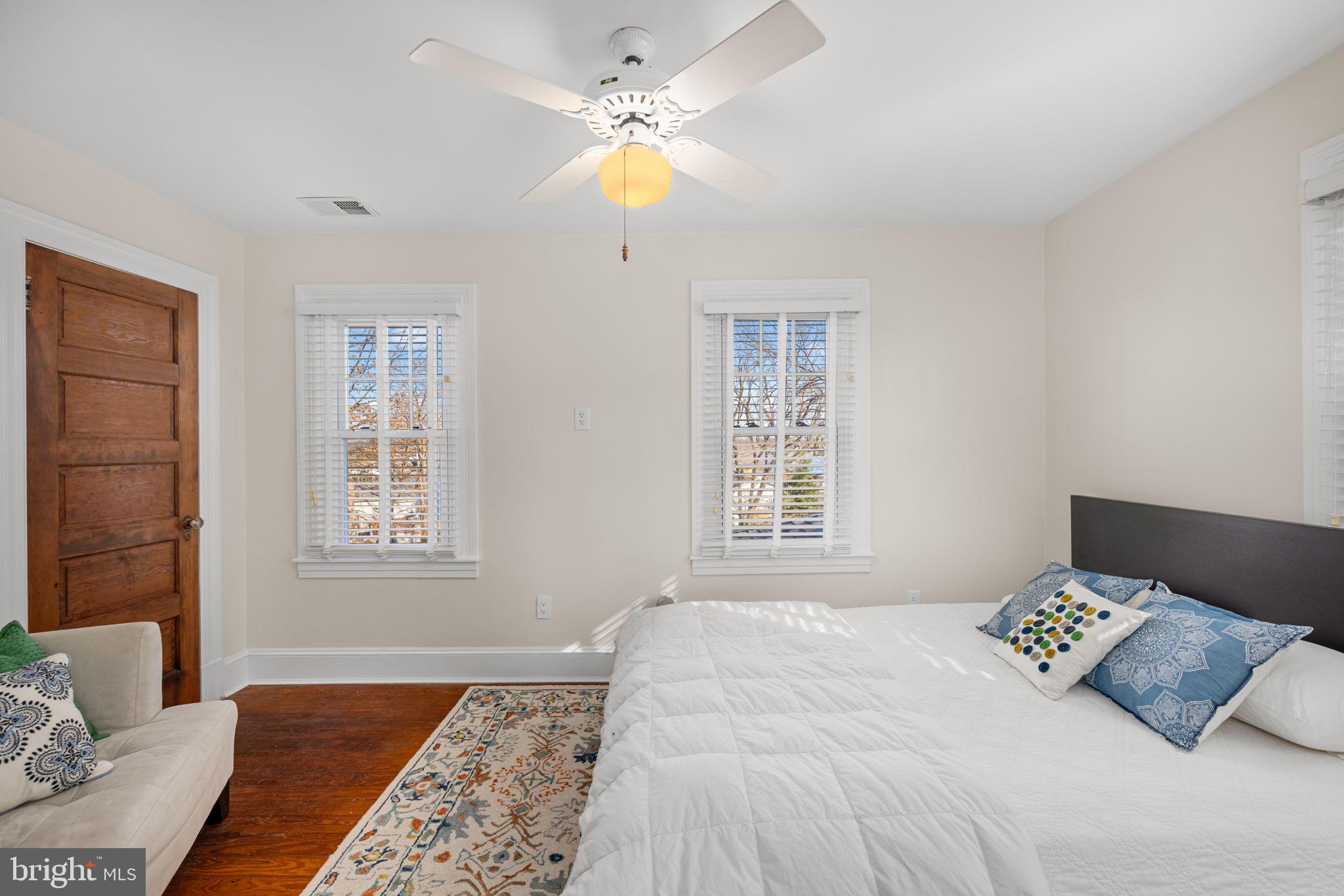 1138 Mayo Road Edgewater, MD 21037 - Photo 27 of 51 a bedroom with a large bed and a chandelier