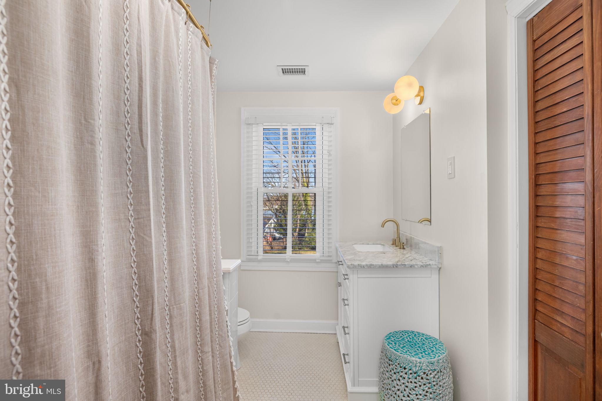 1138 Mayo Road Edgewater, MD 21037 - Photo 29 of 51 a bathroom with a sink and a mirror