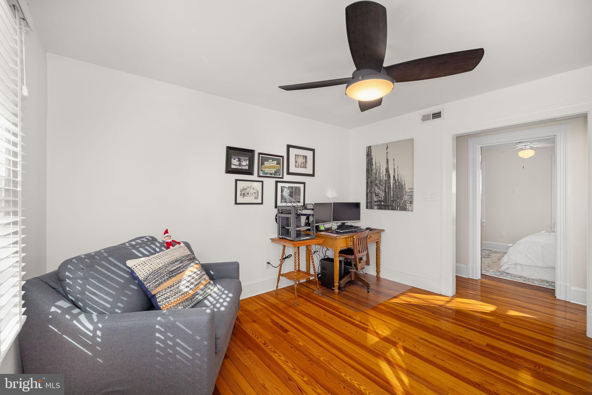 1138 Mayo Road Edgewater, MD 21037 - Photo 31 of 51 a bedroom with a bed and wooden floor