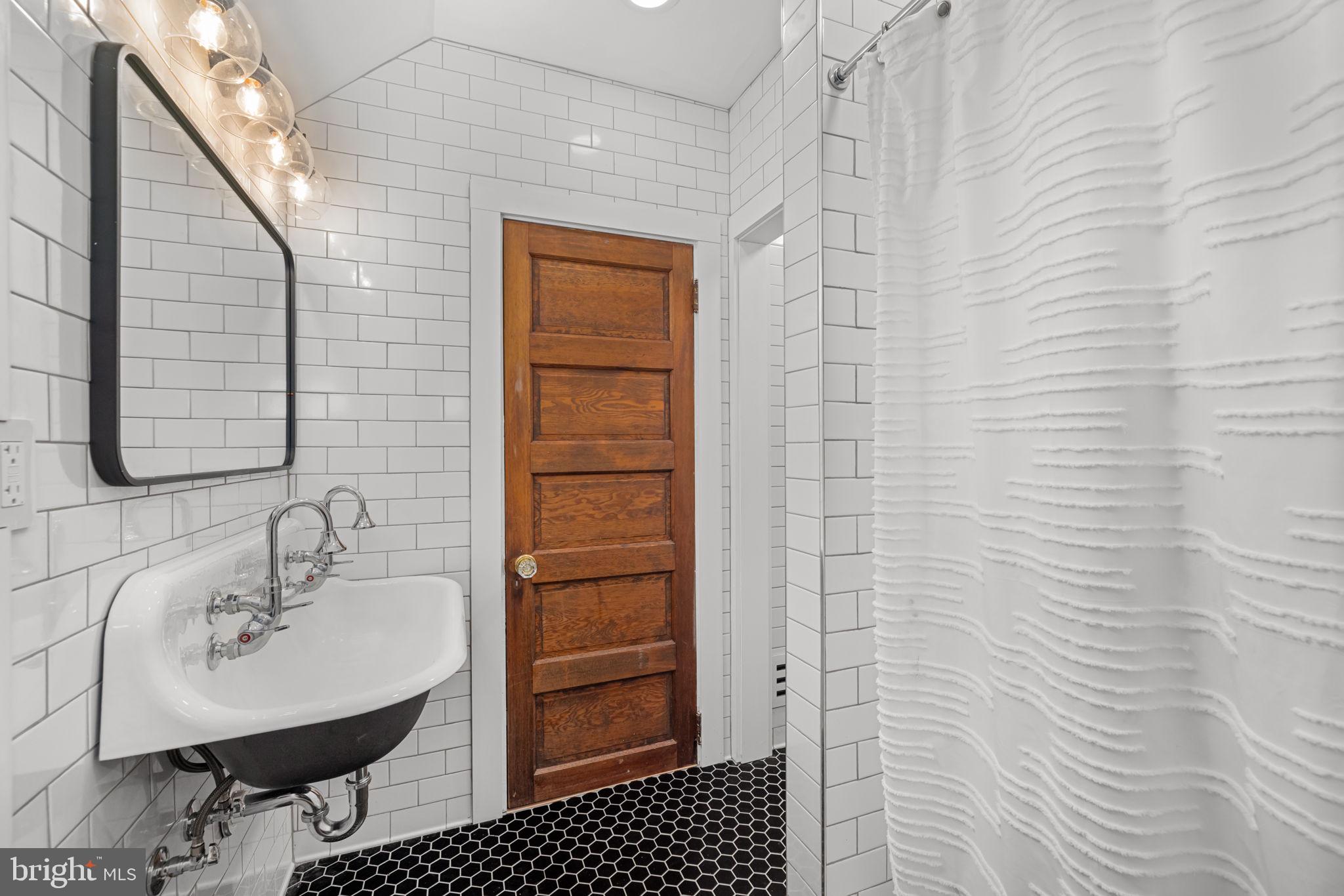 1138 Mayo Road Edgewater, MD 21037 - Photo 35 of 51 a bathroom with a sink a toilet and shower