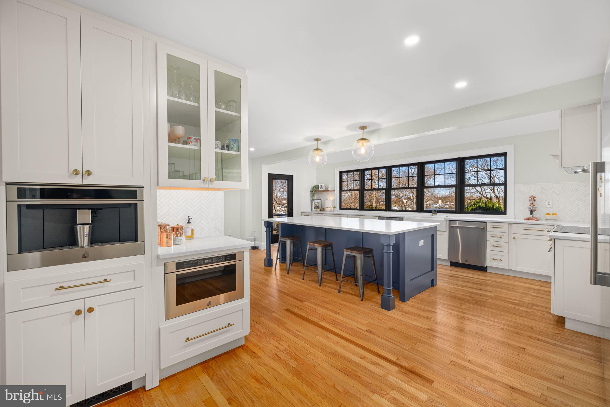 1138 Mayo Road Edgewater, MD 21037 - Photo 6 of 51 a kitchen with stainless steel appliances kitchen island wooden cabinets and granite counter tops