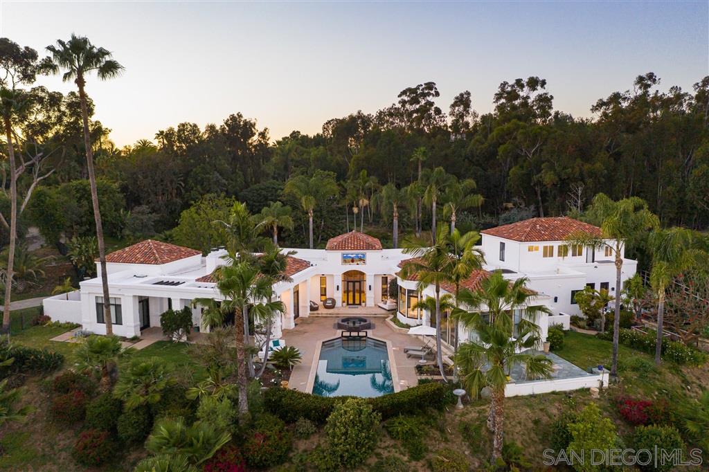 7060 Rancho Cielo Rancho Santa Fe, CA 92067 - Photo 14 of 25 an aerial view of a house with a garden and trees