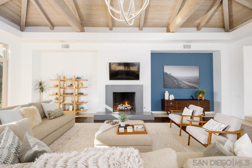7060 Rancho Cielo Rancho Santa Fe, CA 92067 - Photo 4 of 25 a living room with furniture and a fireplace