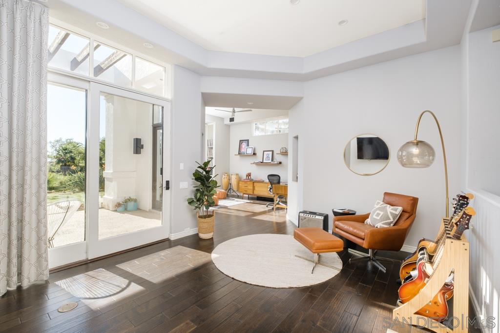 7060 Rancho Cielo Rancho Santa Fe, CA 92067 - Photo 7 of 25 a living room with furniture and a large window