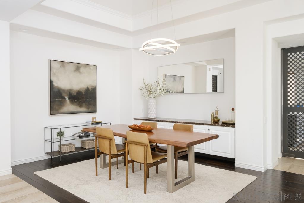 7060 Rancho Cielo Rancho Santa Fe, CA 92067 - Photo 9 of 25 a view of a dining room with furniture and wooden floor