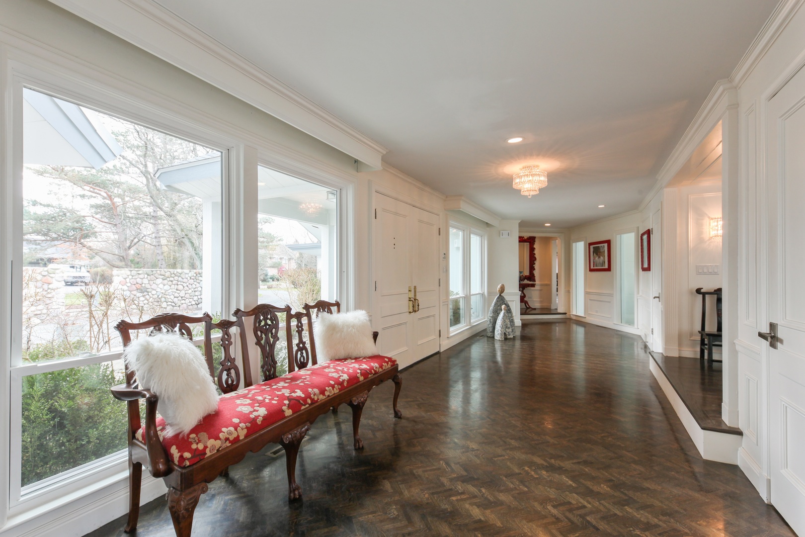 13 Meadowview Road Northfield, IL 60093 - Photo 2 of 23 a living room with furniture and floor to ceiling windows