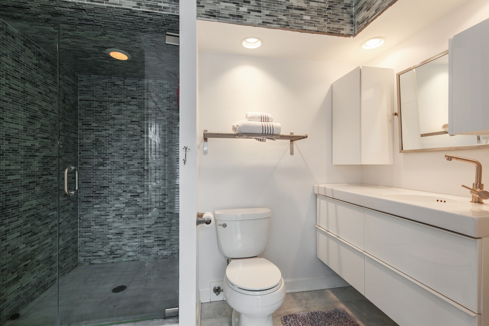13 Meadowview Road Northfield, IL 60093 - Photo 16 of 23 a bathroom with a granite countertop toilet sink and mirror