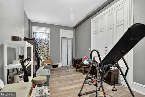 a view of a livingroom with furniture and hardwood floor